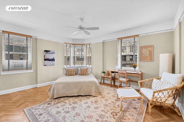 bedroom featuring baseboards, multiple windows, ceiling fan, and visible vents