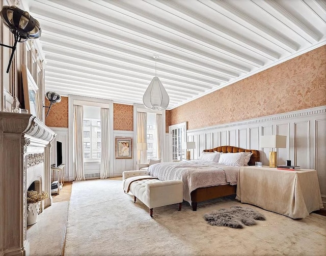 390 W End Ave Unit 6A, New York City, NY 10024 - carpeted bedroom featuring wallpapered walls, a wainscoted wall, a decorative wall, and a fireplace