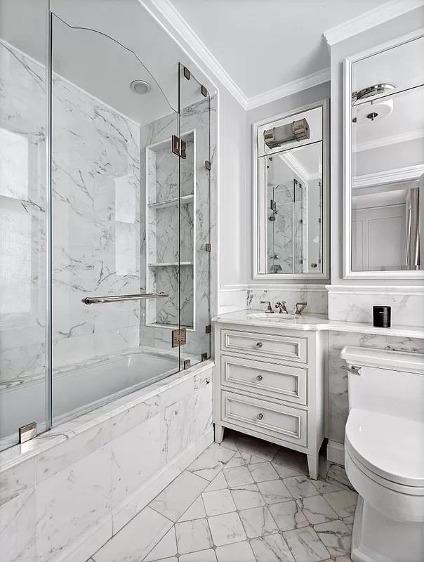390 W End Ave Unit 6A, New York City, NY 10024 - bathroom featuring crown molding, marble finish flooring, toilet, vanity, and a combined bath / shower with marble appearance