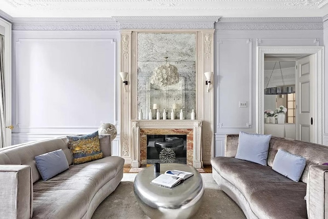 390 W End Ave Unit 6A, New York City, NY 10024 - living room featuring a glass covered fireplace, wood finished floors, and crown molding