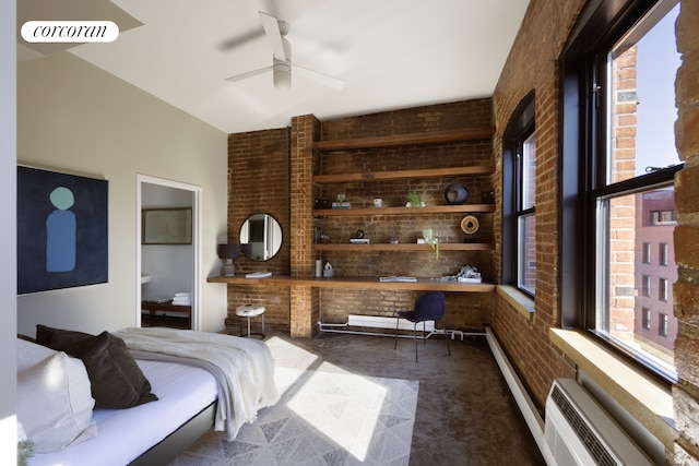 bedroom featuring ceiling fan, ensuite bathroom, brick wall, and visible vents