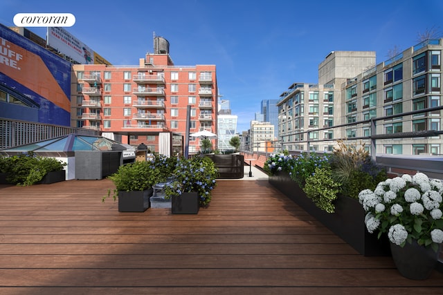 wooden deck featuring a city view