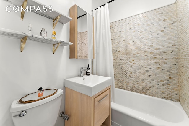 bathroom featuring shower / tub combo, toilet, and vanity