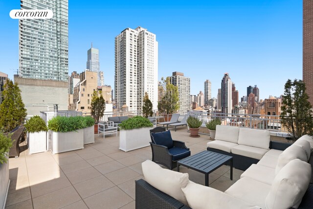 345 E 56th St Unit 21F, New York City, NY 10022 - view of patio featuring an outdoor living space and a view of skyline