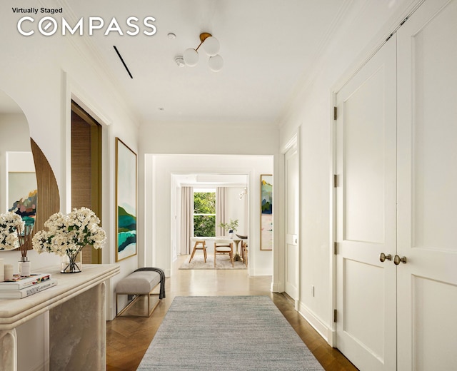 101 W 78th St Unit 3A, New York City, NY 10024 - hall featuring crown molding, dark wood-style floors, and arched walkways