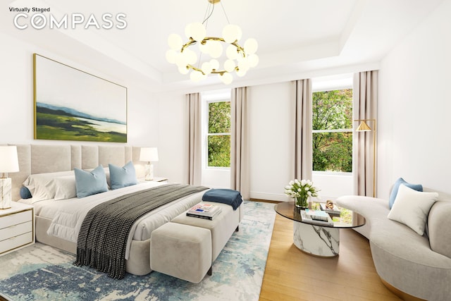 101 W 78th St Unit 3A, New York City, NY 10024 - bedroom featuring a chandelier, wood finished floors, a raised ceiling, and baseboards