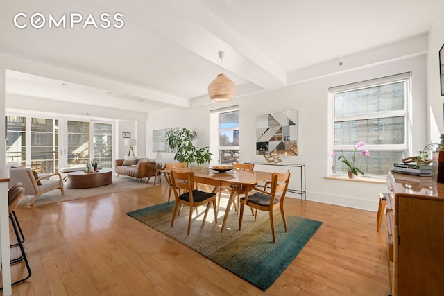57 Front St Unit 303, New York City, NY 11201 - dining space with light wood finished floors and beam ceiling