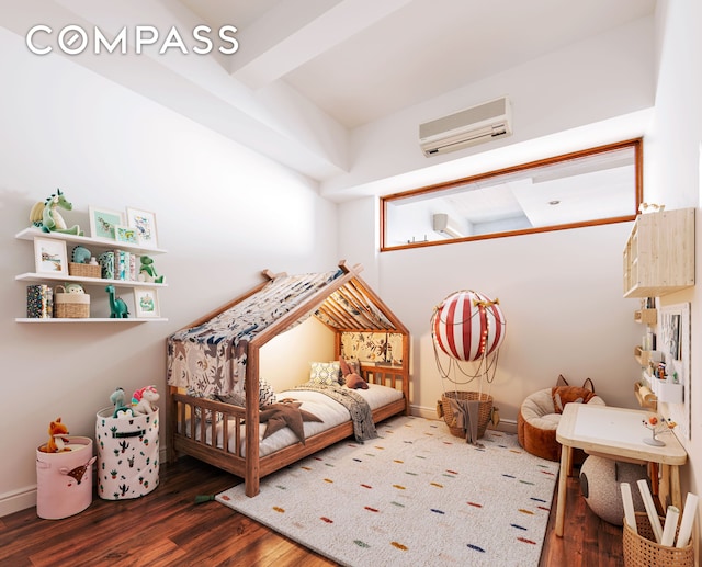 bedroom with baseboards, a wall mounted AC, and wood finished floors