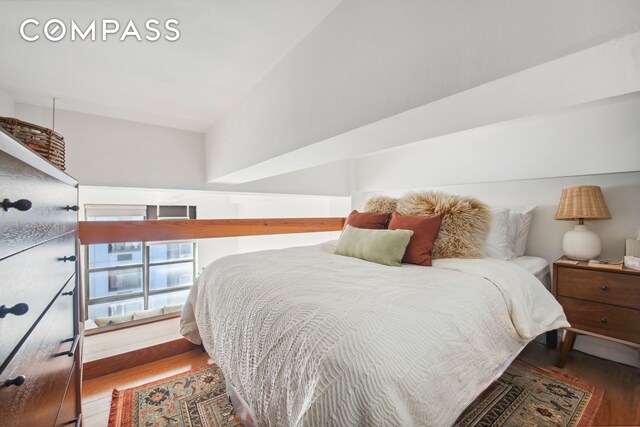 bedroom featuring wood finished floors