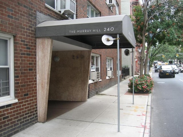 exterior space with brick siding