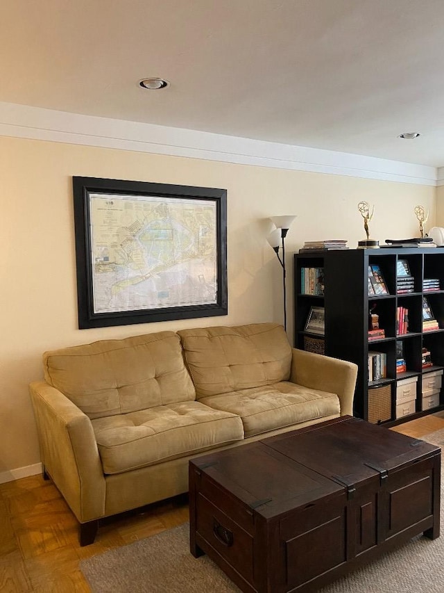 living room featuring baseboards and ornamental molding