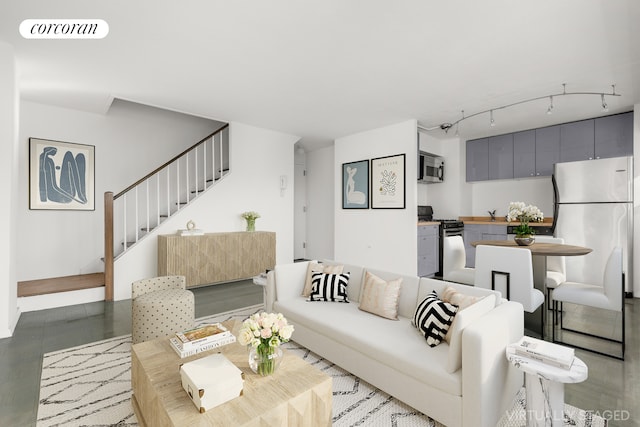 609 Columbus Ave Unit 12F, New York City, NY 10024 - living room featuring stairway and rail lighting
