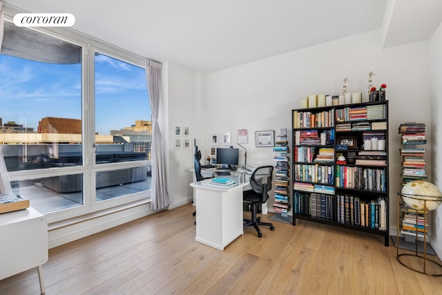 340 E 23rd St Unit Ph3D, New York City, NY 10010 - office with wood-type flooring and baseboards