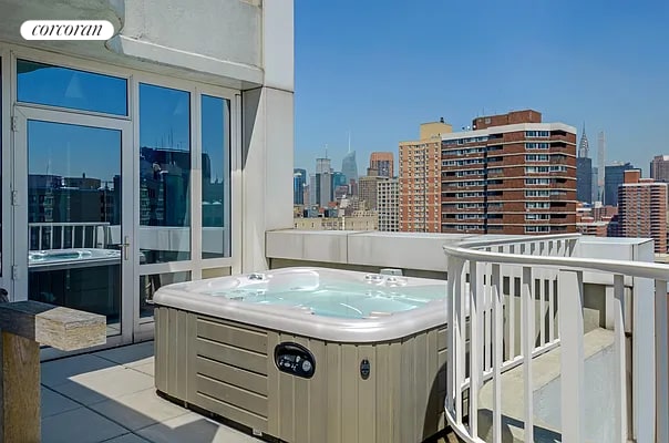 340 E 23rd St Unit Ph3D, New York City, NY 10010 - patio / terrace with a view of skyline and a hot tub