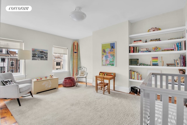 bedroom featuring visible vents and wood finished floors