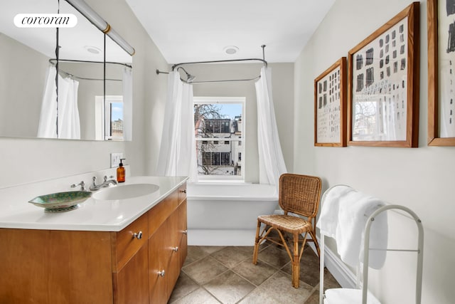 full bath with vanity, shower / bath combo, and visible vents