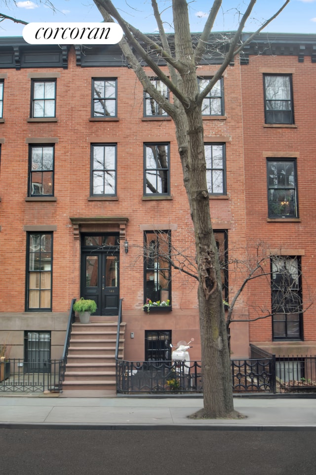 view of front of property featuring brick siding