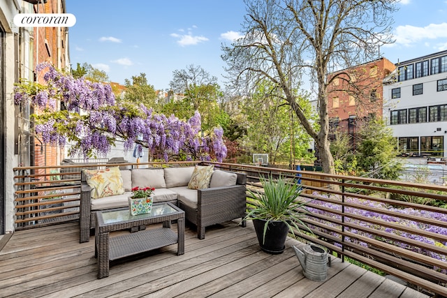 wooden terrace featuring outdoor lounge area