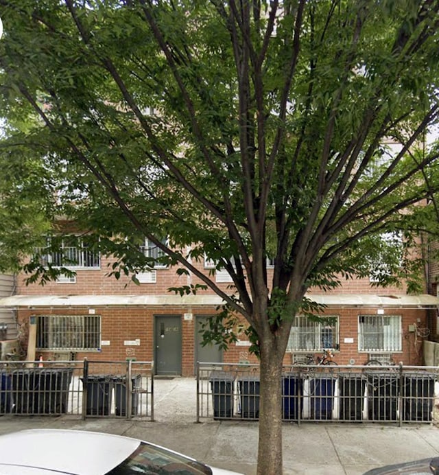 10436-10438 38th Ave, New York City, NY 11368 - view of property with a fenced front yard