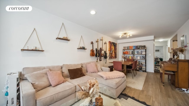 living room featuring visible vents and wood finished floors
