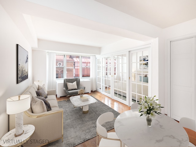 living area featuring french doors and wood finished floors