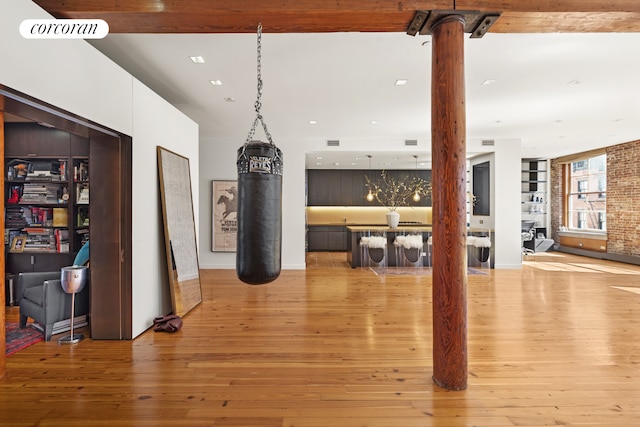 30 Crosby St Unit 4A, New York City, NY 10013 - interior space with brick wall, beam ceiling, and hardwood / wood-style flooring