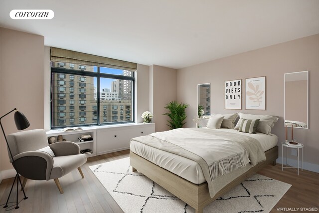 400 E 70th St Unit 1406, New York City, NY 10021 - kitchen featuring stainless steel appliances, a sink, decorative backsplash, baseboards, and light stone counters