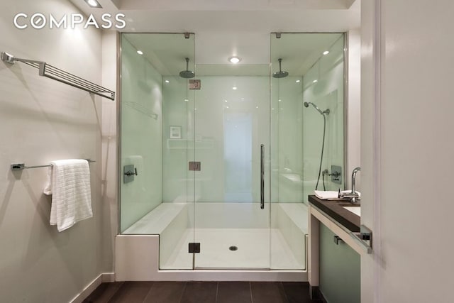 full bathroom featuring a shower stall and recessed lighting