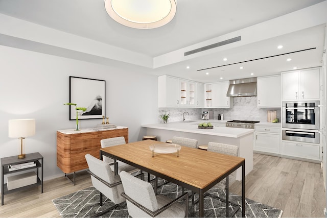 210 W 77th St Unit 7E, New York City, NY 10024 - dining space featuring recessed lighting and light wood-type flooring