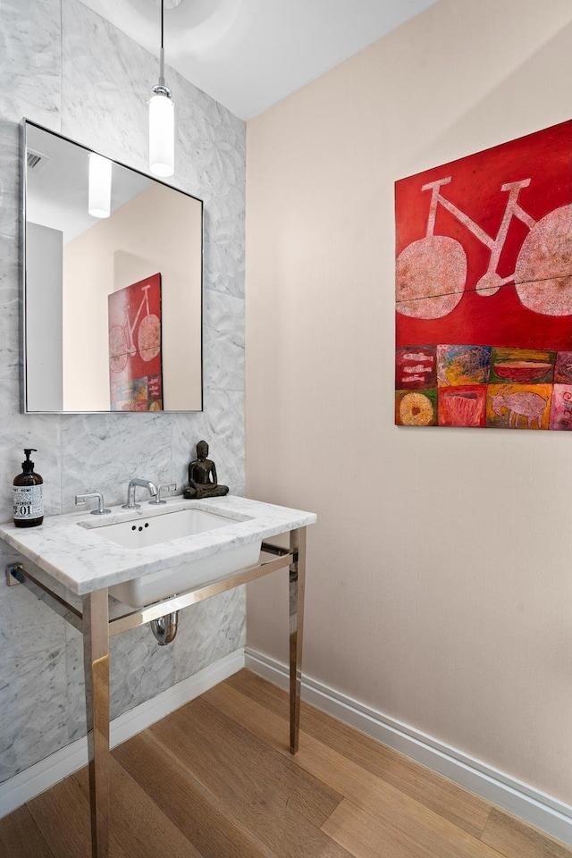 210 W 77th St Unit 7E, New York City, NY 10024 - bathroom with wood finished floors and baseboards