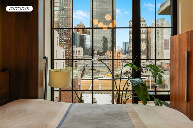 bedroom featuring a city view