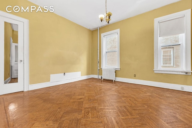 576 5th St Unit B2, New York City, NY 11215 - spare room with radiator, a chandelier, and baseboards