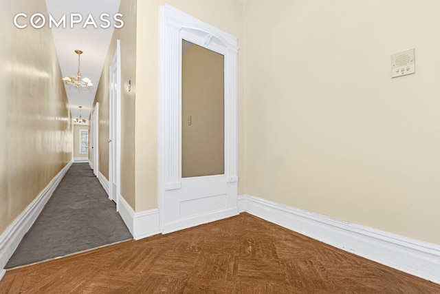 576 5th St Unit B2, New York City, NY 11215 - corridor featuring a chandelier and baseboards