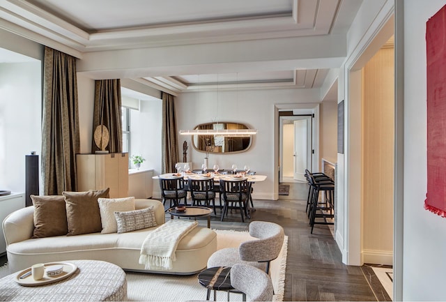 living room featuring baseboards, a raised ceiling, a notable chandelier, ornamental molding, and parquet flooring