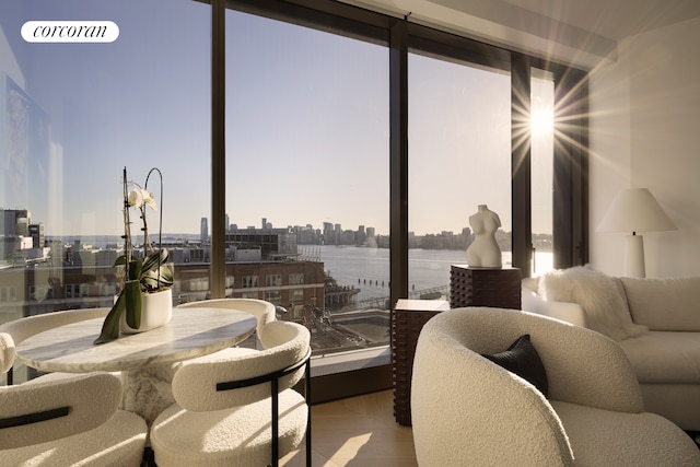 interior space featuring a water view and a city view