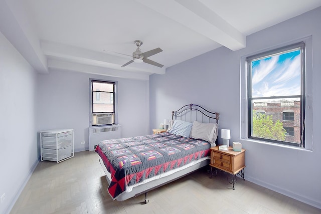 bedroom with radiator heating unit, cooling unit, baseboards, and a ceiling fan