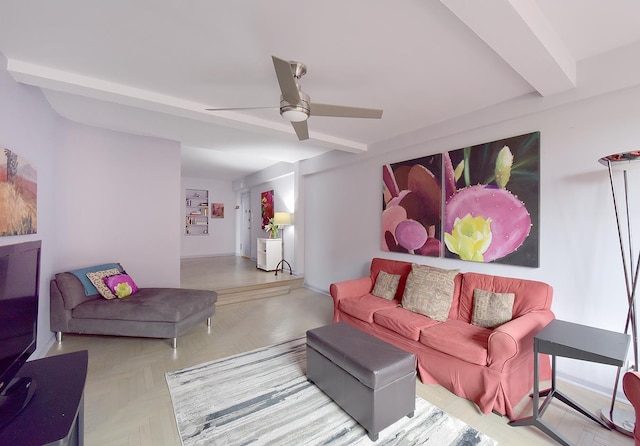 living area featuring a ceiling fan