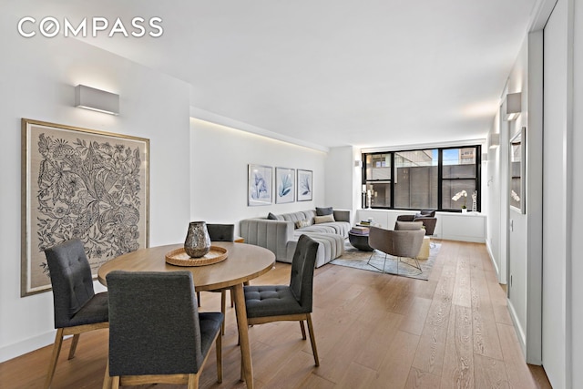 dining room with light wood-style flooring