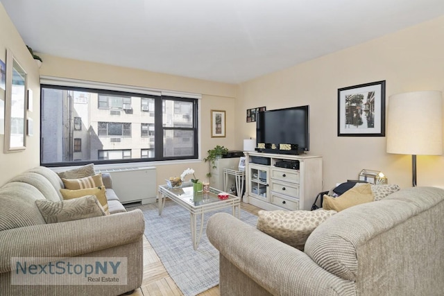 333 E 66th St Unit 7A, New York City, NY 10065 - living area featuring radiator and wood finished floors