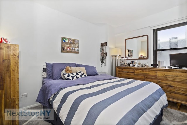 333 E 66th St Unit 7A, New York City, NY 10065 - bedroom featuring baseboards