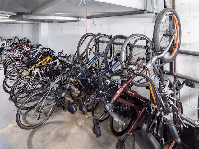 360 W 22nd St Unit 8N, New York City, NY 10011 - garage featuring concrete block wall and bike storage
