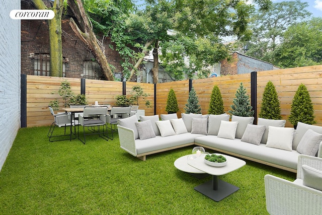 view of patio with outdoor dining area, a fenced backyard, and an outdoor hangout area