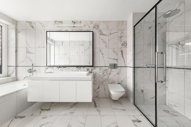 427 E 90th St Unit Ph10, New York City, NY 10128 - bathroom with tile walls, a marble finish shower, vanity, a garden tub, and toilet