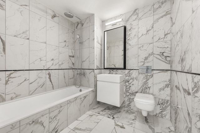 427 E 90th St Unit Ph10, New York City, NY 10128 - bathroom featuring vanity, tile walls, tiled shower / bath combo, toilet, and marble finish flooring
