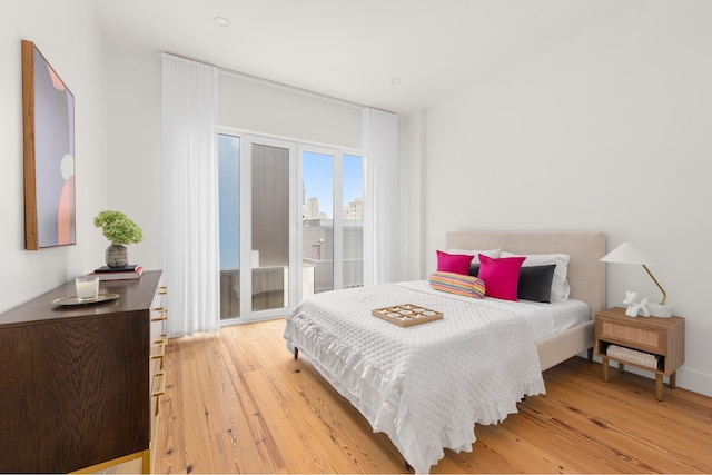427 E 90th St Unit Ph10, New York City, NY 10128 - bedroom with access to exterior and light wood finished floors