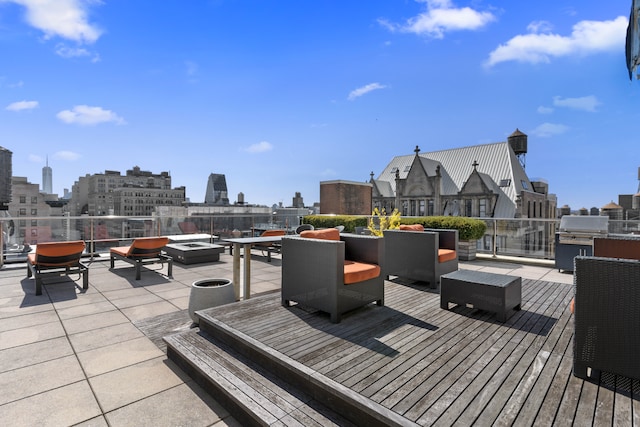 141 5th Ave Unit 3A, New York City, NY 10010 - wooden deck featuring a view of skyline and grilling area