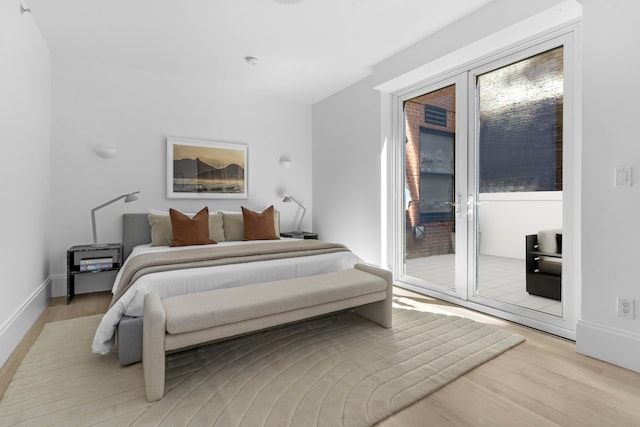 141 5th Ave Unit 3A, New York City, NY 10010 - bedroom featuring access to outside, light wood-style floors, and baseboards