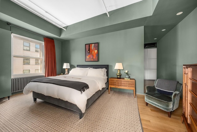 165 Hudson St Pha, Pha, New York City, NY 10013 - bedroom with radiator heating unit, wood finished floors, and recessed lighting