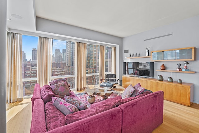 80 Riverside Blvd Unit 16-P, New York City, NY 10069 - living area featuring hardwood / wood-style floors and a skyline view