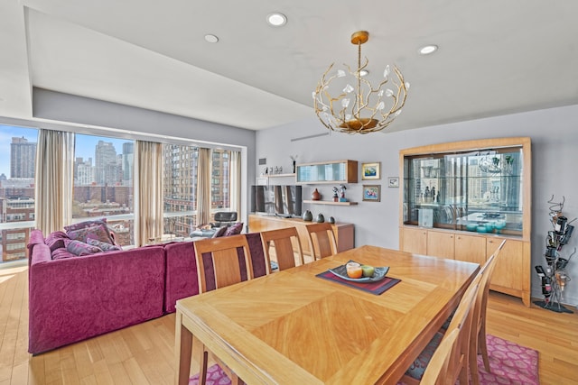 80 Riverside Blvd Unit 16-P, New York City, NY 10069 - dining space with a chandelier, light wood-type flooring, and recessed lighting